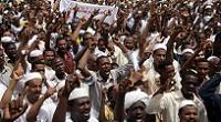  Sudanese men shout slogans during a protest against Israel's military operation in the Gaza Strip in the capital Khartoum on July 18, 2014. (photo credit: AFP/EBRAHIM HAMID) 