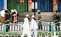  2 Uighurs pass the Grand Bazaar 
